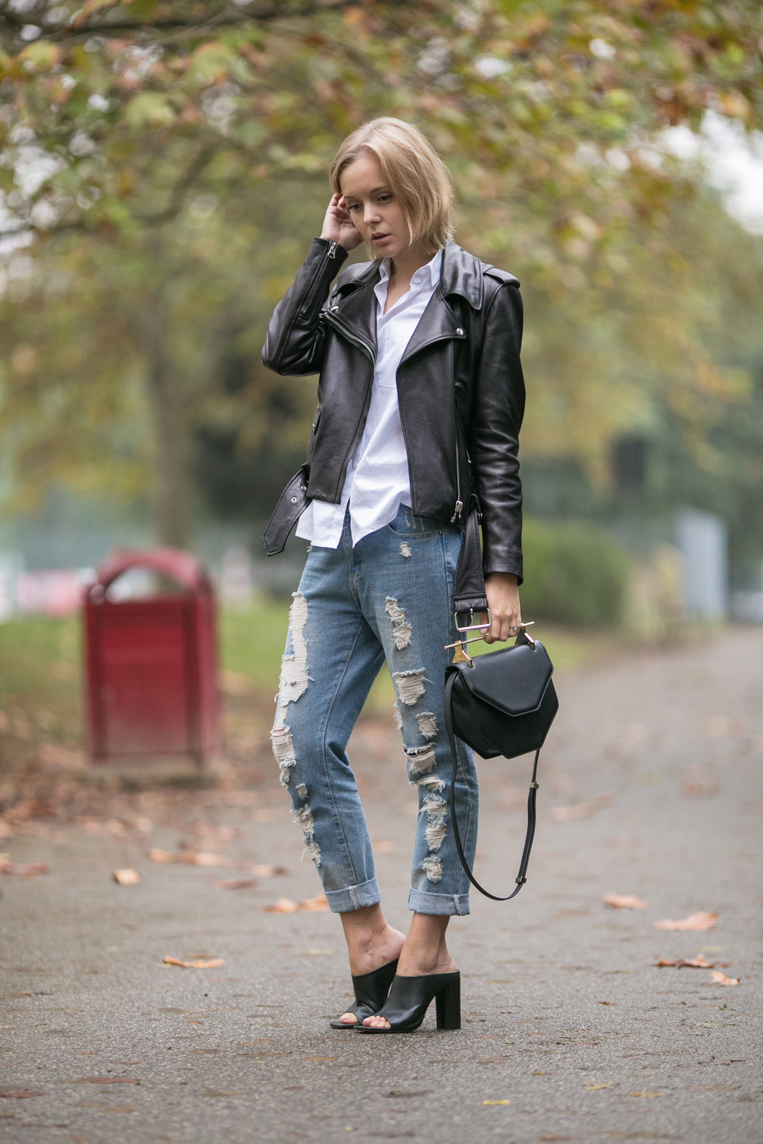 darya kamalova thecablook russian fashion lifestyle blogger in italy outfit spring acne mape leather jacket with boyfriend ripped jeans mules ans m2malletier black bag